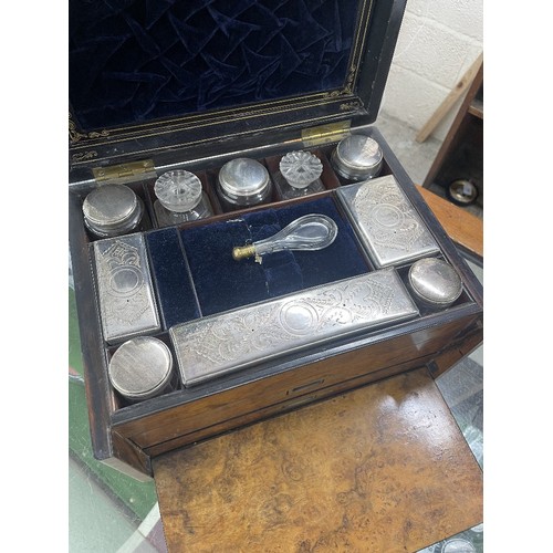 714 - Victorian walnut vanity travelling case, the hinged cover with brass presentation plaque enclosing a... 