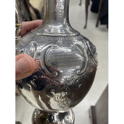 1187 - Good Victorian silver claret jug, with a leaf cast scroll handle and hinged cover, over a half repou... 