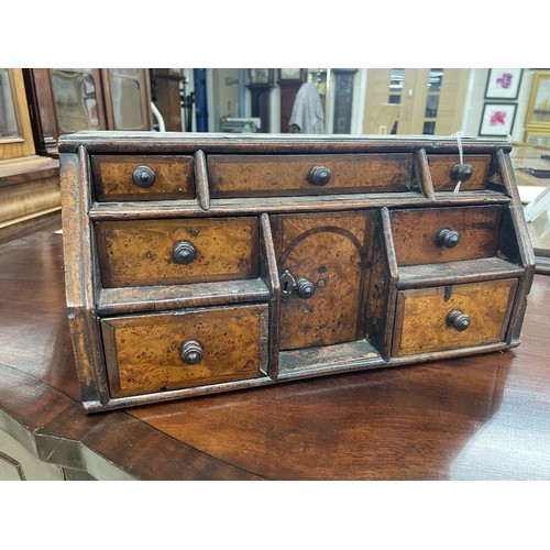 1244 - 18th century burr walnut and cross banded table-top stationary chest, the slope front with seven dra... 