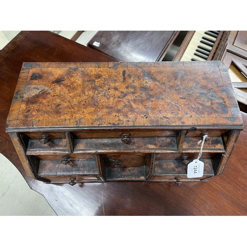 1244 - 18th century burr walnut and cross banded table-top stationary chest, the slope front with seven dra... 