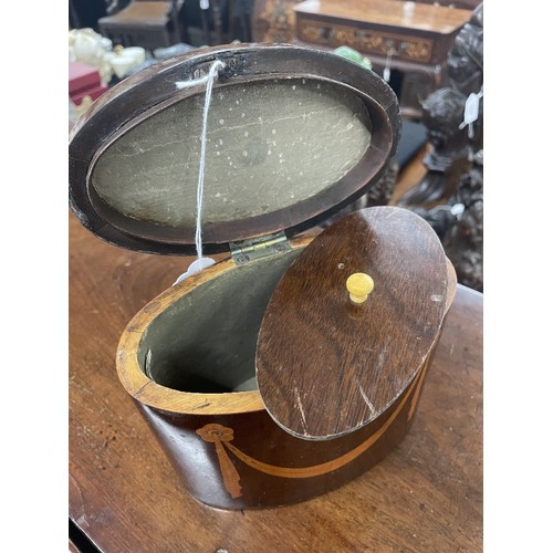 1267 - George III oval mahogany inlaid tea caddy, the top inlaid with an oval conch shell paterae enclosing... 