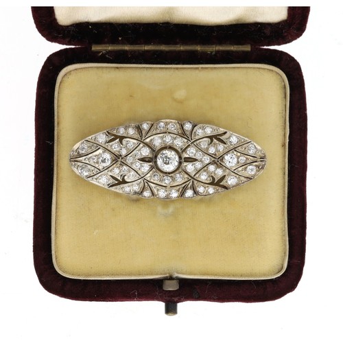 295 - Attractive antique platinum diamond set oval brooch, set with old-cut diamonds in a stylised millegr... 