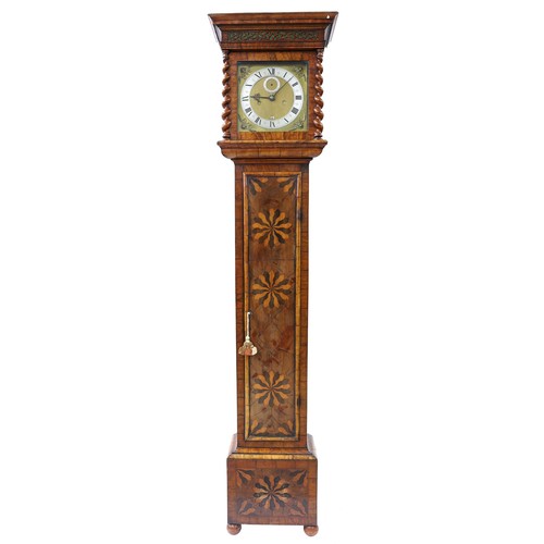 Dr John Plowman - Good olivewood and marquetry eight day longcase clock with five pillar movement, the 10" square brass dial signed Johannes Fromanteel, Londini, fecit on the dial plate beneath six o'clock, with silvered chapter ring enclosing a matted centre with subsidiary seconds dial, shuttered winding holes and calendar aperture, the case with long beaded moulded edged door inlaid with flowerheads over the base with similar inlay, the sides with sectional oyster veneers and the rising hood with flat moulded stepped cornice over a pierced foliate fret carved frieze, 79" high (with pendulum, two brass cased weights and keys)