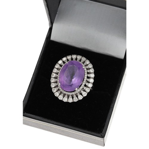 44 - Large impressive modern 18ct white gold amethyst and diamond ring, the centre oval amethyst 16mm x 1... 