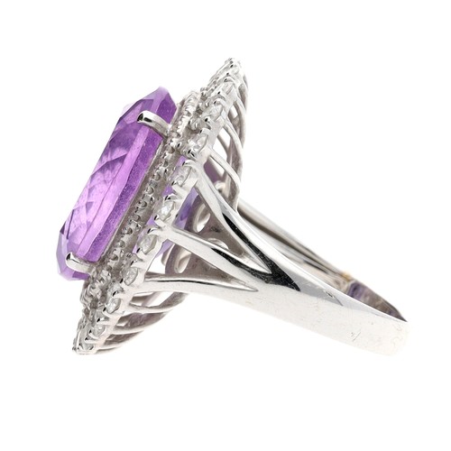 44 - Large impressive modern 18ct white gold amethyst and diamond ring, the centre oval amethyst 16mm x 1... 