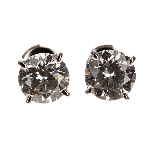 114 - Cartier - fine pair of GIA certified diamond stud earrings, round brilliant-cuts, both clarity 1.37c... 