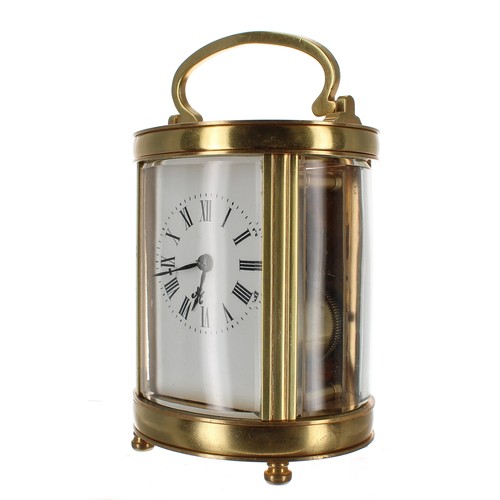 1223 - French oval carriage clock striking on a gong, within a brass case, 6.25