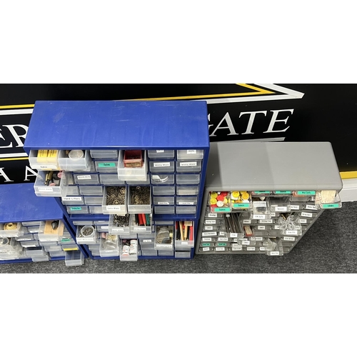 551 - Six plastic multi drawer storage organiser cabinets containing an assortment of watch parts and tool... 