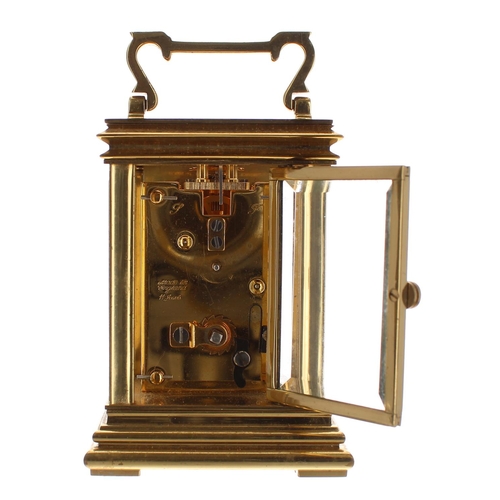 1236 - Miniature carriage clock timepiece, the back plate stamped Made in England, 11 jewels, the dial sign... 