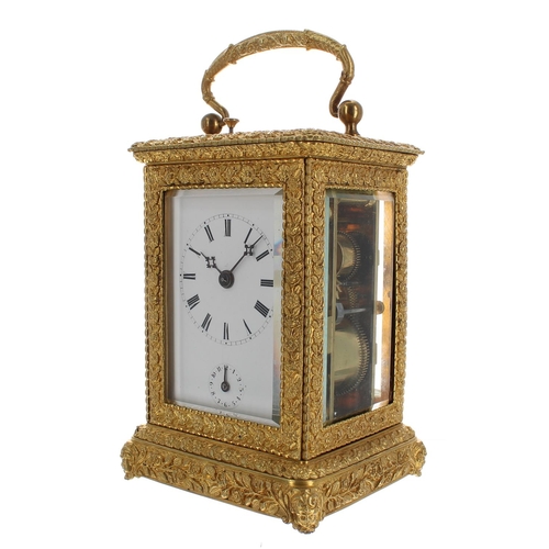 1241 - Ornate repeater carriage clock with alarm and striking on a bell, within a decorative case cast with... 