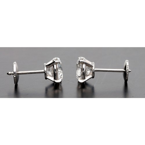 114 - Cartier - fine pair of GIA certified diamond stud earrings, round brilliant-cuts, both clarity VVS2,... 