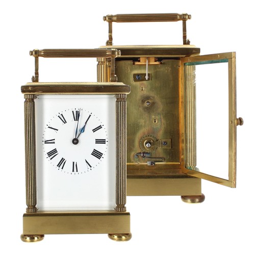 1205 - Repeater carriage clock with alarm and striking on a gong, within a pillared gorge style brass case,... 