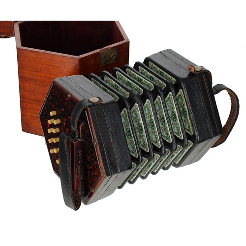 2562 - Lachenal & Co two row Anglo, concertina with twenty bone buttons on pierced mahogany ends, five-... 