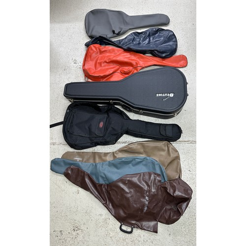 1091 - Ovation acoustic guitar hard case; together with a Stagg gig bag and six guitar soft bags (8)... 
