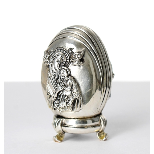 518 - Greek 999 silver egg ornament, cast with Orthodox Jesus opposite Mary and Child, on an integral stan... 
