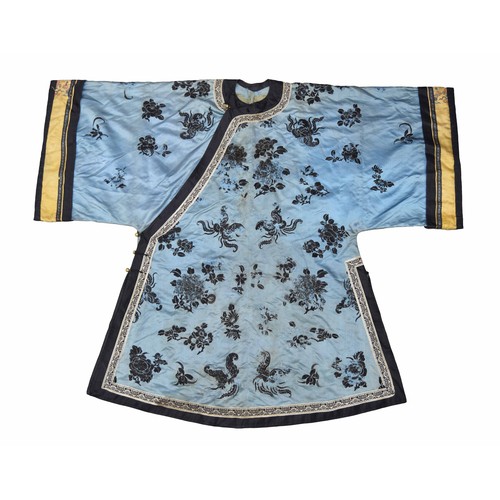 Late 19th/early 20th century Chinese silk robe, decorated with deep blue floral motif on a pale blue ground, the sleeves with a gold band and polychrome flowers, with sphere toggle fastening at the side