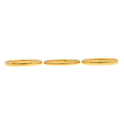 273 - Three 22ct wedding band rings, each with clear British hallmarks, 7.8gm in total (3)... 