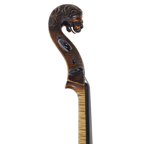 155 - 19th century Bavarian violoncello with carved lion's head scroll, unlabelled, the two piece back of ... 