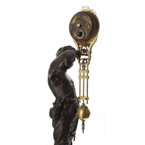 1306 - French bronzed mystery mantel clock timepiece, modelled as a young peasant boy holding aloft the pen... 