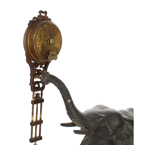 1307 - French bronzed mystery mantel clock timepiece, modelled as an elephant holding aloft the pendulum ti... 