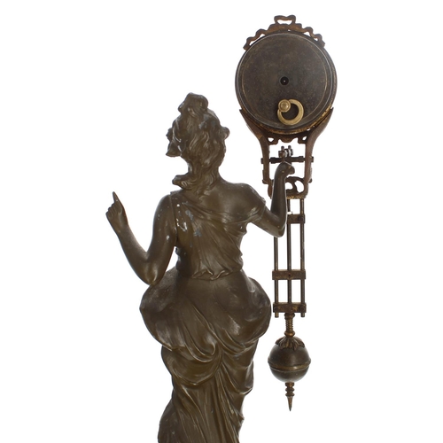 1309 - French bronzed mystery mantel clock modelled as a maiden in flowing robes holding aloft the pendulum... 