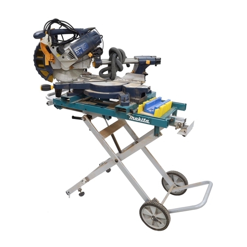 1553 - Mac Allister MMS255SL sliding mitre saw upon folding Makita trolley