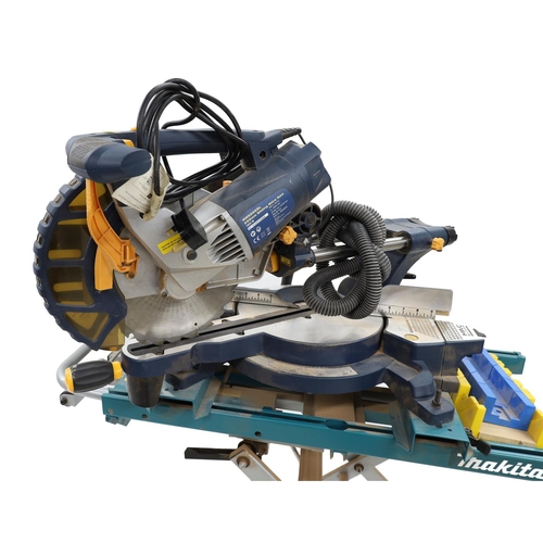 1553 - Mac Allister MMS255SL sliding mitre saw upon folding Makita trolley
