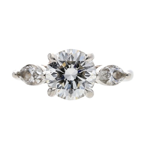 Tiffany & Co. platinum brilliant-cut diamond solitaire ring with marquise cut shoulders, the centre diamond 1.58ct, clarity VS1, colour E, width 7.5mm, 5.30gm, ring size I (331)