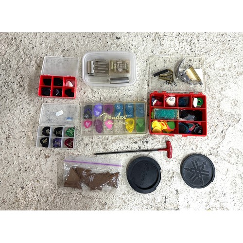 1519 - Selection of guitar accessories to include a large selection of guitar picks, two sound hole feedbac... 