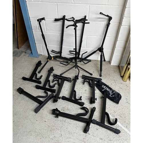 1534 - Selection of guitar stands to include a Hercules single guitar stand, an Ultimate Support single gui... 