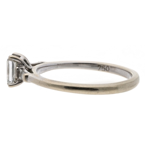 98 - 18ct white gold emerald-cut solitaire diamond ring with tapered baguette set shoulders, 0.45ct appro... 