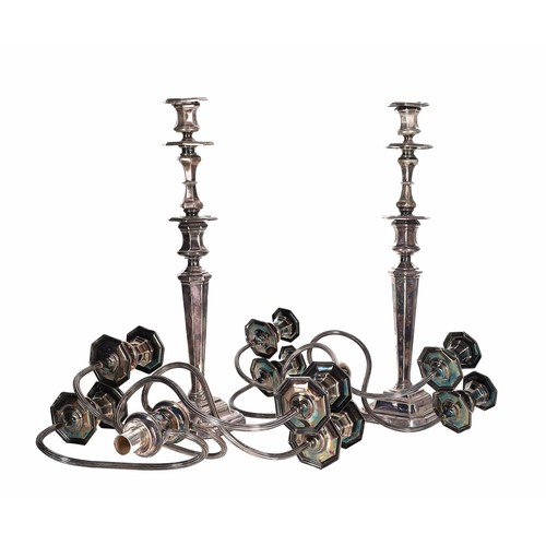 444 - Pair of George V silver metamorphic candelabra, each having five sconces on reeded wavy supports, de... 