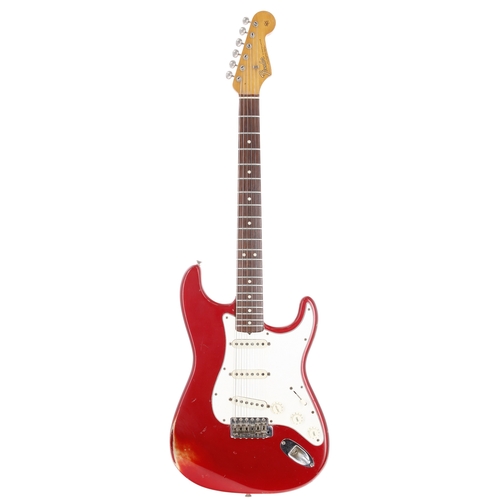 1966 Fender Stratocaster electric guitar (1965 Spec), made in USA; Body: candy apple red finish, surface finish rubbing to arm contour edge, blemishes and dings throughout, some dropfill to finish on front and lower body edge, possible light overspray to front; Neck: '65 spec small head, maple, 2NOV65B neck stamp, appears refinished with later decal; Fretboard: Indian rosewood; Frets: re-fret, mild wear; Electrics: working, potentiometers stamped 32nd week of 1965, pickups with 1966 pen inscribed dating; Hardware: generally good, L Series serial neck plate, minor damages to spring cavity back plate; Case: early 1970s Fender hard case; Weight: 3.69kg; Overall condition: good for age