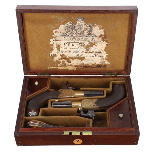 Good pair of pocket percussion pistols by Blissett, London, having fluted turn-off barrels, engraved and inscribed plates, concealed triggers, safety slides and chequered walnut grips over silver lion head butt caps, bearing proof marks to the undersides, well presented in the original mahogany fitted case having some remnants of the I Blissett trade label to the underside cover and bearing a brass name plaque for U T Todd, the pistols 6" long overall, also with a small fluted copper and brass shot flask
