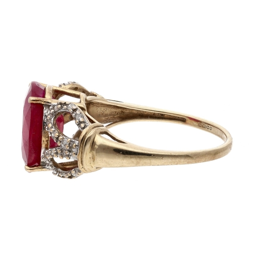 Large 9ct ruby and diamond dress ring with openwork shoulders, the ruby ...