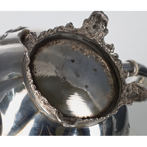 528 - Victorian silver teapot, the hinged cover with flower stem finial, over a repousse lobed melon form ... 