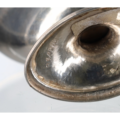 545 - George III silver boat shaped bon bon basket, having a swing handle over, raised on a tall support, ... 