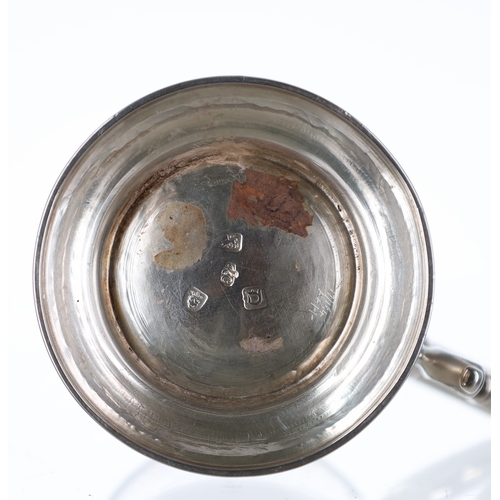 547 - George III silver tankard, having a c scroll handle and raised on a wide foot rim, maker RC, London ... 