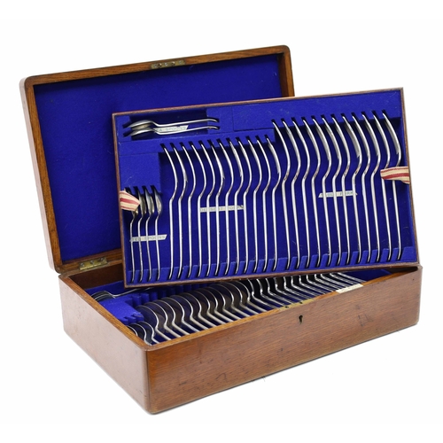 Oak cased canteen of Walker & Hall silver rat tailed cutlery, comprising twelve table forks 7.75", dessert forks 7", table spoons 8.25" dessert spoons 7" and tea spoons 5", all having a script monogram K to the handles, hallmarks for Sheffield 1911, 107oz t total, the oak case cover with inset shield cartouche, enclosing a tiered interior, 16" wide, 10" deep, 4.5" high