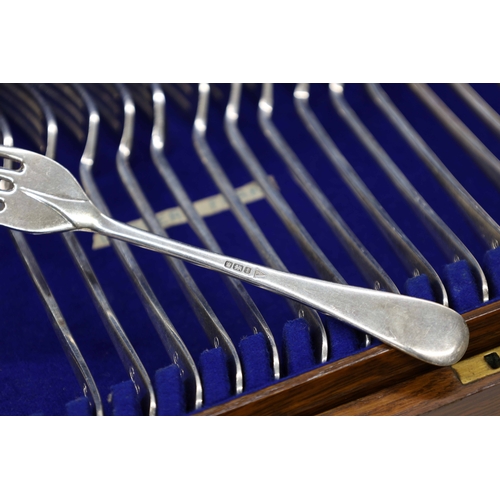 523 - Oak cased canteen of Walker & Hall silver rat tailed cutlery, comprising twelve table forks 7.75... 