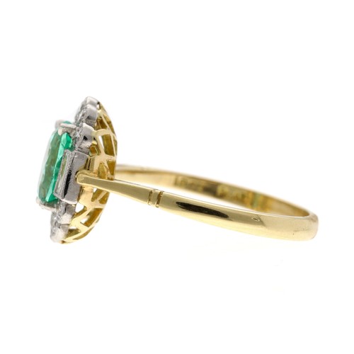 57 - Attractive oval emerald and diamond yellow metal dress ring, the emerald 1.15ct approx, in a white m... 