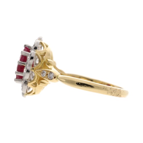 55 - Impressive ruby and diamond oval cluster ring with set shoulders, the oval ruby 1.50ct approx set in... 