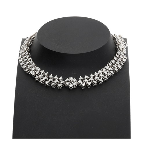 Attractive white gold diamond set foliate design bracelet, consisting of round brilliant-cut diamonds, estimated 3.50ct approx in total, with safety chain, stamped 21K, 24.5gm (436)