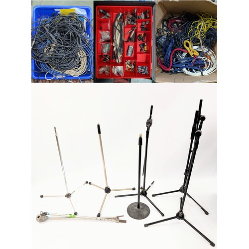 1885 - Selection of microphone stands; together with a large selection of various audio cables and connecto... 