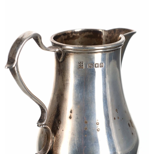 410 - George V silver baluster cream jug, scroll handle and circular foot, Pairpont Brothers, London 1919,... 
