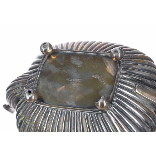 412 - Late Victorian silver teapot, rounded oblong shape with half fluted body and scroll handle, on ball ... 