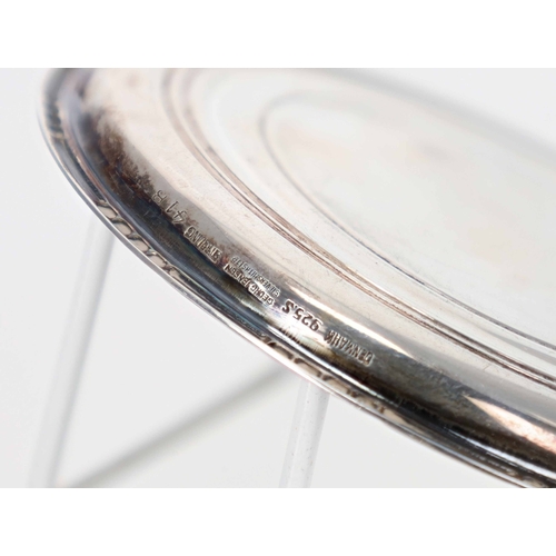 540 - Danish silver small circular dish and miniature ladle, marked for Georg Jensen, Denmark, the dish 3.... 
