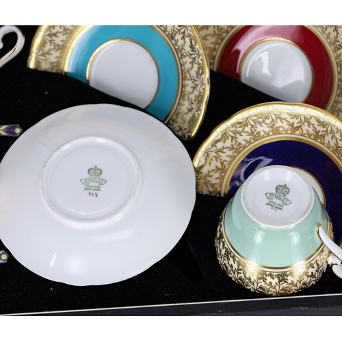 665 - Cased set of Aynsley cabinet cups and saucers, with silver and enamel spoons (some damages)... 