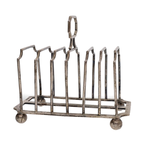 407 - George V silver six division toast rack, with central handle on ball feet, Martin Hall & Co, She... 
