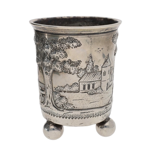 462 - 19th century continental white metal beaker, worked in relief with a building and church among trees... 